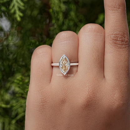 Marquise bezel ring with faceted marquise-cut center stone on slim silver band