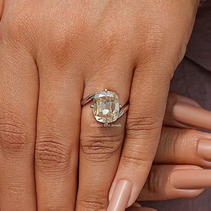Sterling silver bypass shank solitaire ring with cushion-cut clear moissanite on fingers