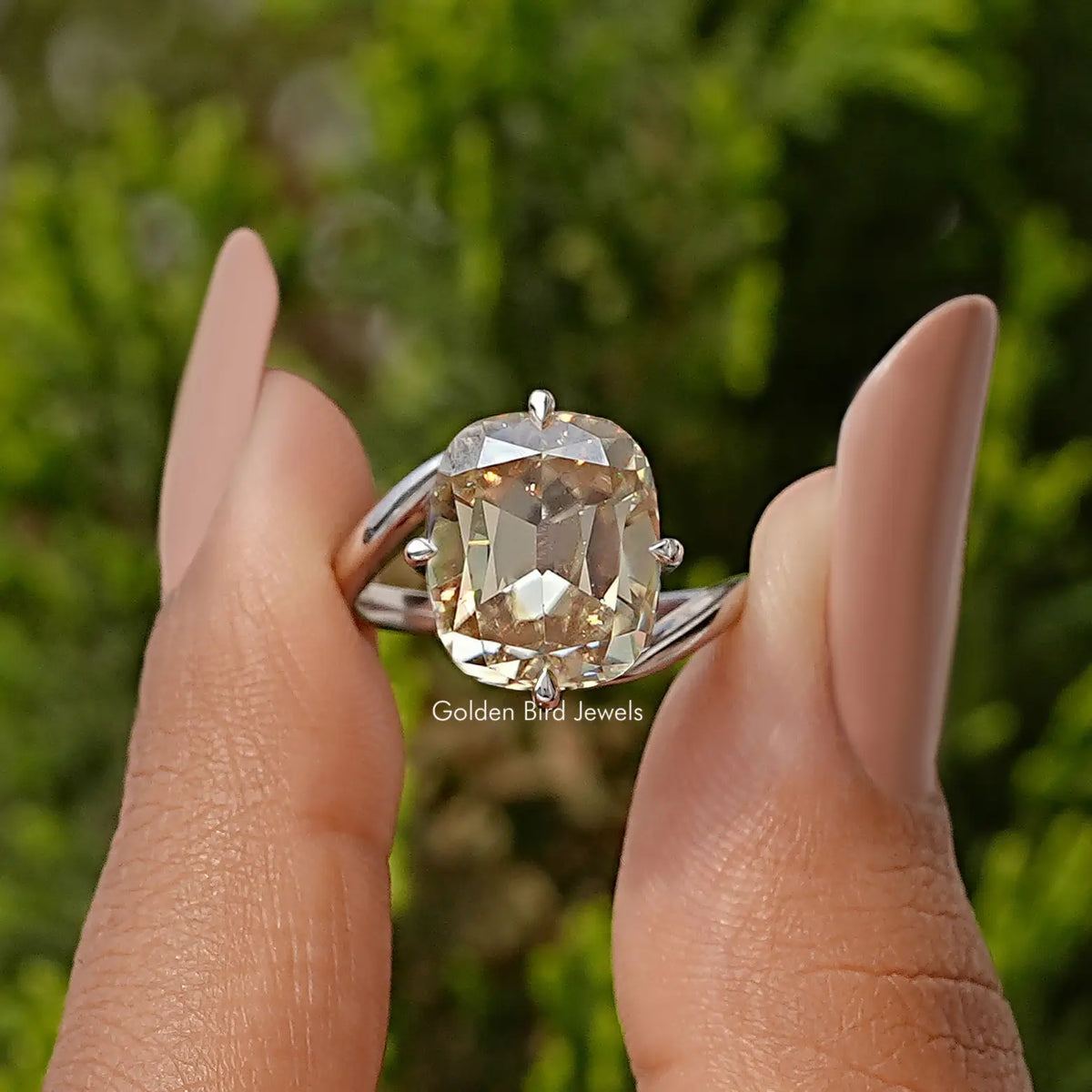 Sterling silver bypass shank solitaire ring with cushion-cut clear moissanite center
