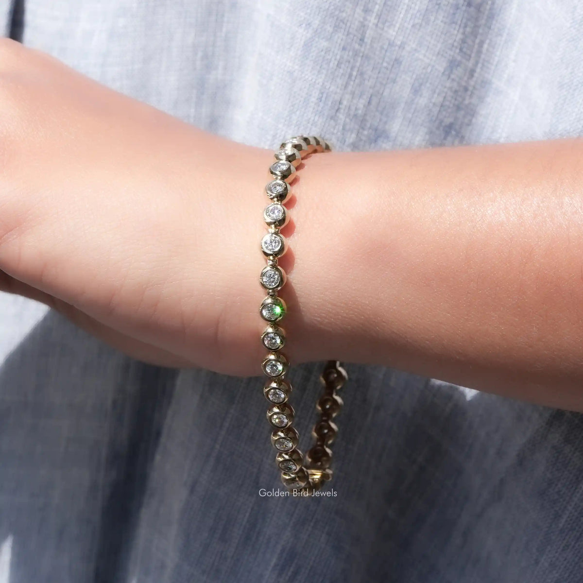 Moissanite bezel setting bracelet with round stones, stacked wrist view