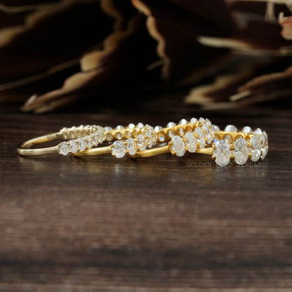 Gold-tone oval-cut moissanite half-eternity wedding band with oval stones