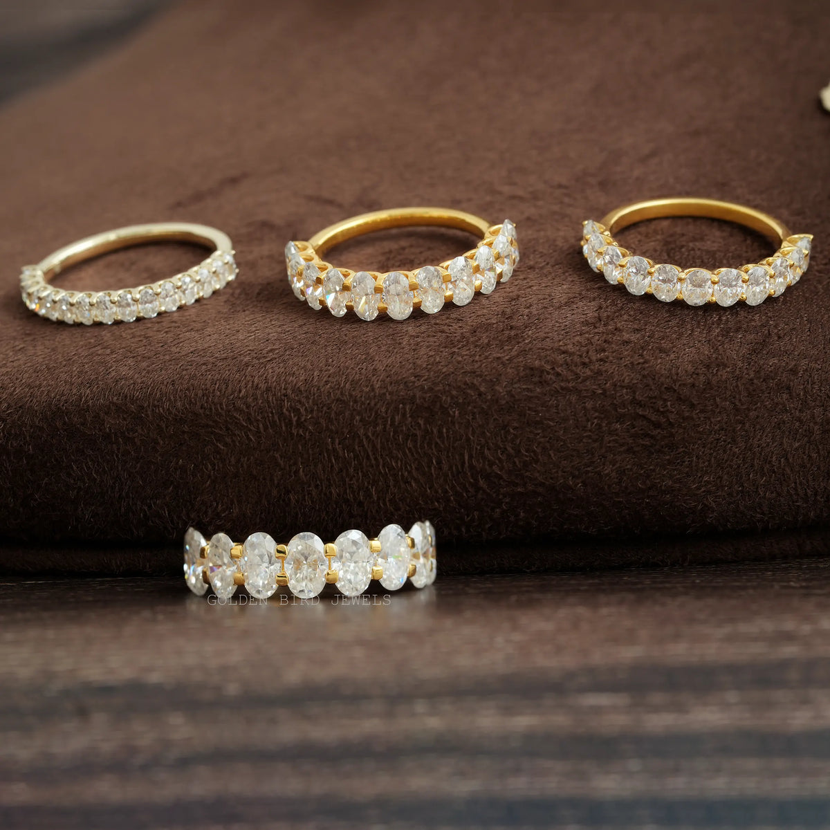 Oval-cut moissanite half-eternity wedding bands, gold- and silver-tone with oval stones