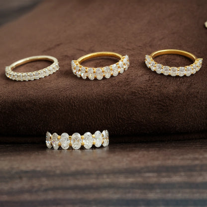 Oval-cut moissanite half-eternity wedding bands, gold- and silver-tone with oval stones
