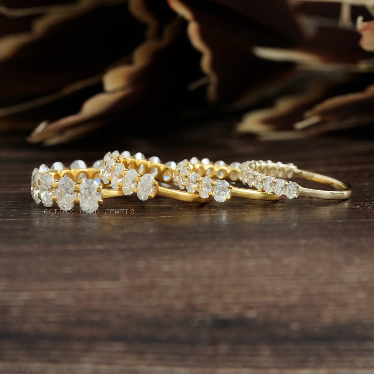 Gold-tone oval-cut moissanite half-eternity wedding band with oval-stone row