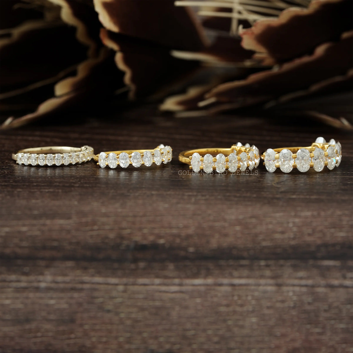 Oval-cut moissanite half-eternity wedding bands with oval stones, gold- and silver-tone